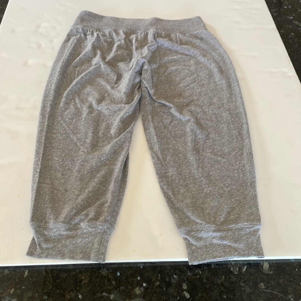 Under Armour sweats that stop below the knee.